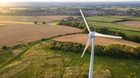Lonely wind turbine in farm fields, East Sussex, UK.の写真素材