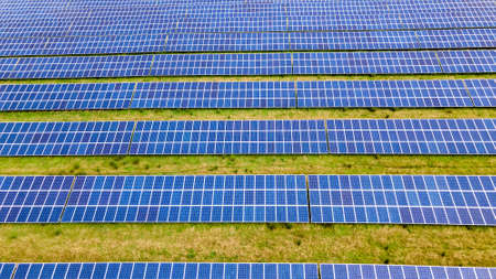 Solar power farm in the evening, fields of West Sussex, UK.