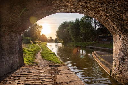 Old stone bridge actoss narrov canal by the small town Sandbach, Staffordshire, UK.の写真素材