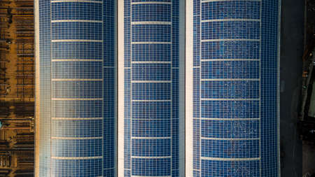 Aerial view of solar panels on warehouse top roof in industrial estate, Hove, East Sussex, UK.の写真素材