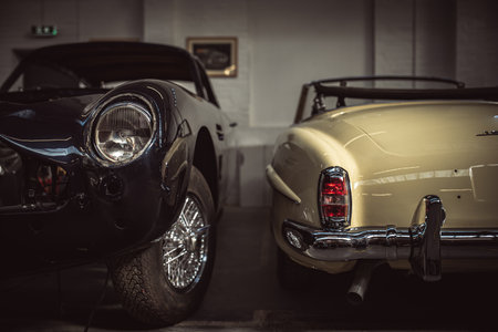 Classic cars being restored in a vintage vehicle garage workshopの写真素材