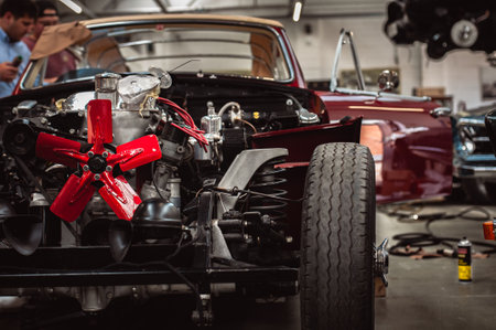 Classic cars being restored in a vintage vehicle garage workshop