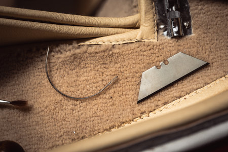 Classic car interior restoration process with tools laying around