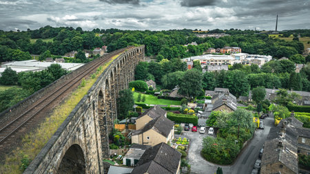 Rail viaduct going through the small town in Yorkshire, Denby Dale, Huddersfield, UKの写真素材