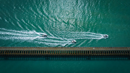 Aerial view of few boats in blue waters of Newhaven, East Sussex, UKの写真素材