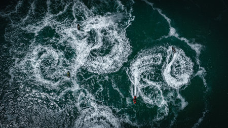 Aerial view of jet ski around Brighton pier on a sunny summer day, East Sussex, UKの写真素材