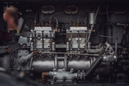 Old tractor diesel engine on a display under the motor cover.の写真素材