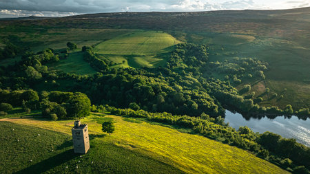 Small tower on top of the hill surrounded by lake in remote location of Yorkshireの写真素材