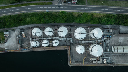 Aerial view of industrial gas storage oil refinery near port in Brighton and Hove, East Sussex, UK.の写真素材