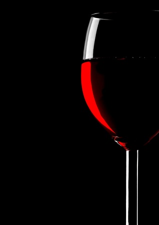 Abstract silhouette of wineglass on blackの写真素材