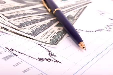 Dollars denomination,ballpoint pen and finance scheduleの写真素材