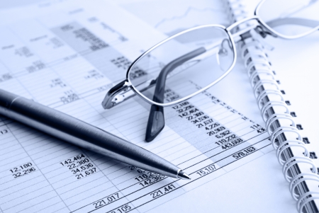 Ballpoint pen,glasses and financial report Ballpoint pen,glasses and financial report