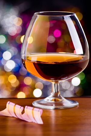 Glass from a brandy on a color backgroundの写真素材
