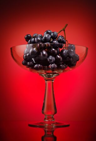 Ripe grape in glass bowlの写真素材