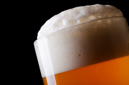 Beer froth in glass close-upの写真素材