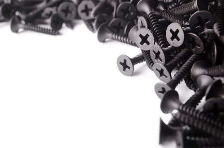 Black screws on a white background の写真素材