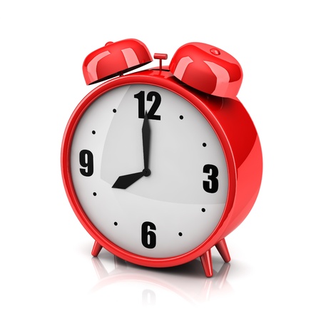 Red alarm clock on a white backdropの写真素材