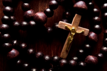Closeup of wooden cross and rosaryの写真素材