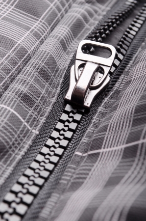 Closeup of opened clothing zipperの写真素材