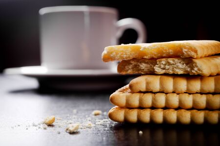 Closeup of cookies and cofee cup on backgroundの写真素材
