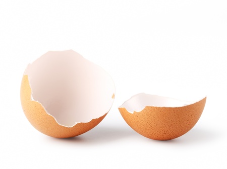 Broken egg on a white backgroundの写真素材