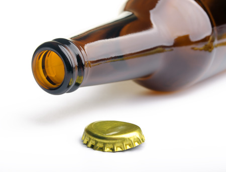 Isolated opened bottle with  crown cap on a white backgroundの写真素材
