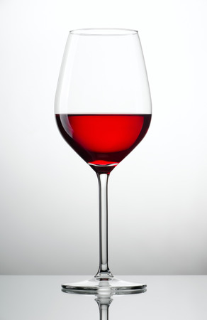 Red wine glass photo on white backgroundの写真素材