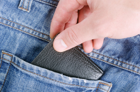 Stealing wallet from back pocket of jeans