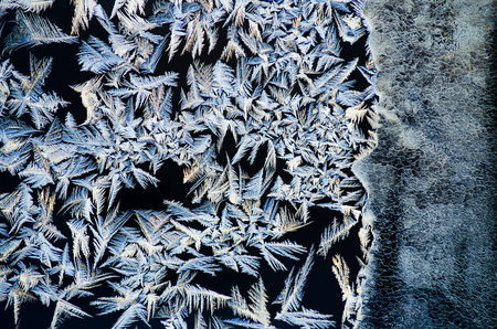 Winter frosted drawing on window glass
