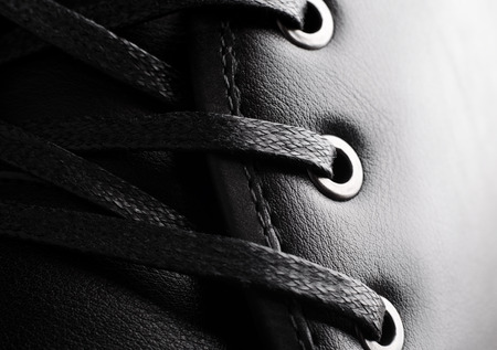 Close-up photo of black shoelaces on bootの写真素材