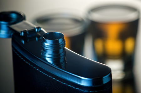 Open steel flask of alcohol drinkの写真素材