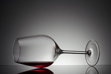 Wineglass with red wine on glassの写真素材