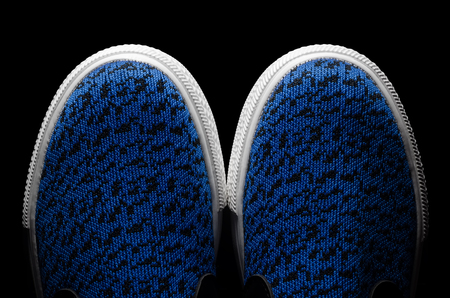 Top view of sneakers shoes on black isolatedの写真素材