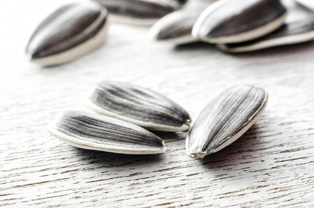Sunflower seeds closeup on a woodenの写真素材