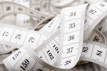 Closeup photo of white tapeline with black numbersの写真素材