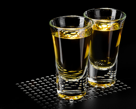 Two tequila shots on blackの写真素材