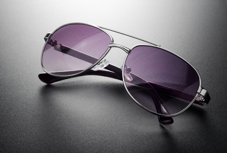 Sunglasses aviator style on a black backgroundの写真素材