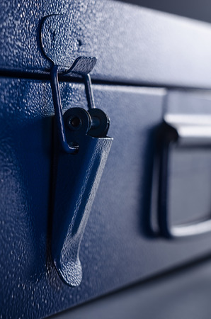 Latch lock of blue metallic box close upの写真素材