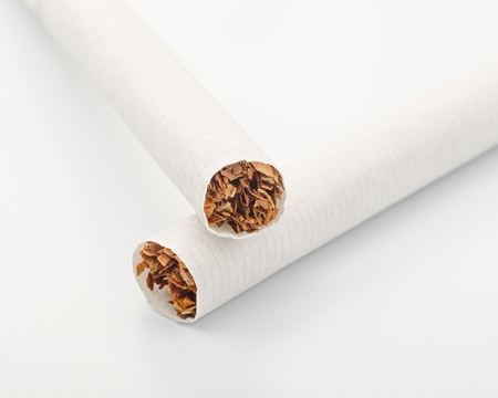 Two cigarettes on white close up
