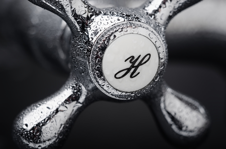 Faucet handle with hot water close upの写真素材