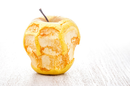 Bitten dry apple on white.の写真素材