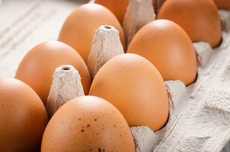 Eggs in a paper tray closeup.の写真素材