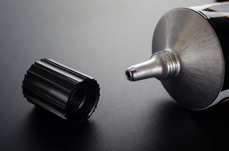 Glue tube with open cap closeupの写真素材