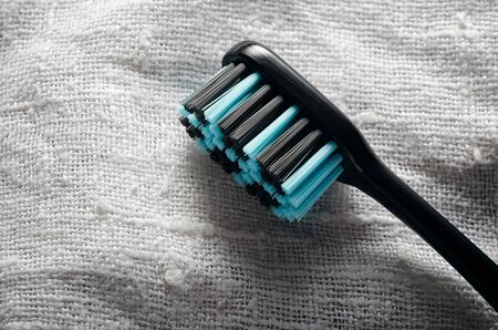 Manual toothbrush on the flax backgroundの写真素材