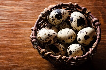 Quail eggs in basket closeupの写真素材