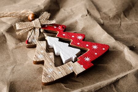 Fir-tree christmas toy on crumpled paper closeupの写真素材