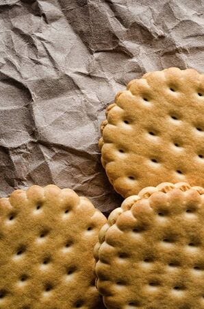Cookies on a crumpled packing paperの写真素材