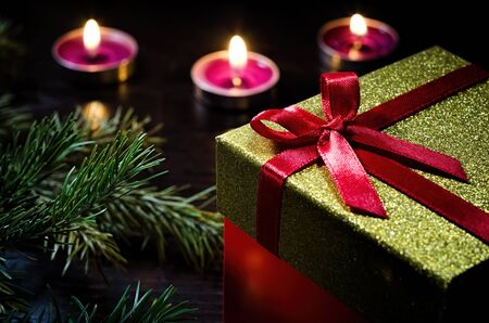 Gift box close-up in the candle lightの写真素材