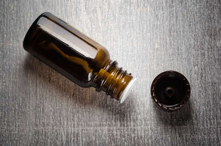 Aroma essential oil open bottle and capの写真素材