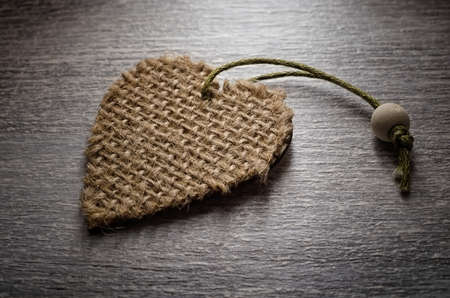 Christmas decoration of heart form on a white wooden backgroundの写真素材
